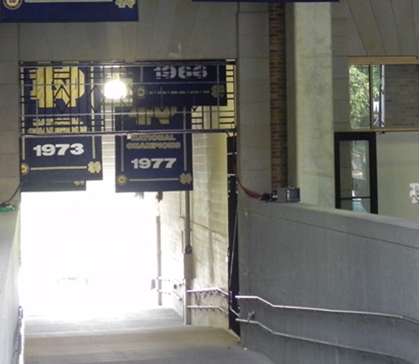 The football locker room doors and the ND Mural leading to the stadium field ramp