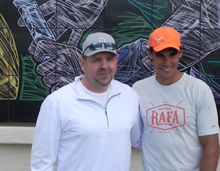 Mike S. and Rafael Nadal pose at the mural during the ceremony for the media and crowd