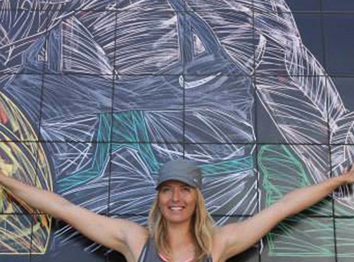 Maria Sharapova at the BNP Paribas Open in front of her mural in Indian Wells, CA