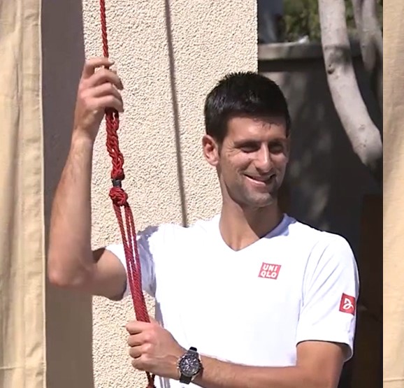 Novak Djokovic gets ready to unveil his mural at the Indian Wells Tennis Garden