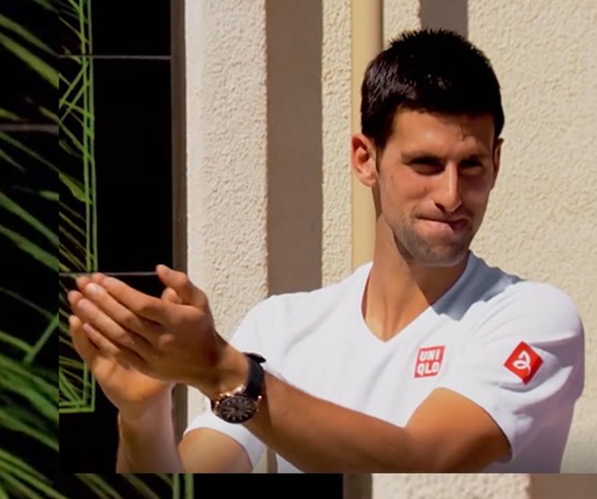 Novak Djokovic reacts to his Championship Mural at the Indian Wells Tennis Garden