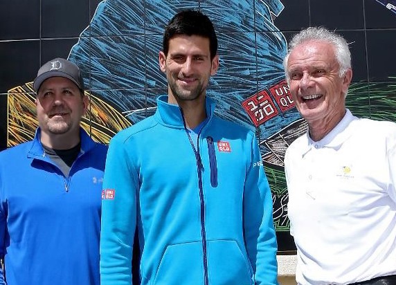 Mike S., Novak Djokovic and Raymond Moore in front of the mural at the IWTG