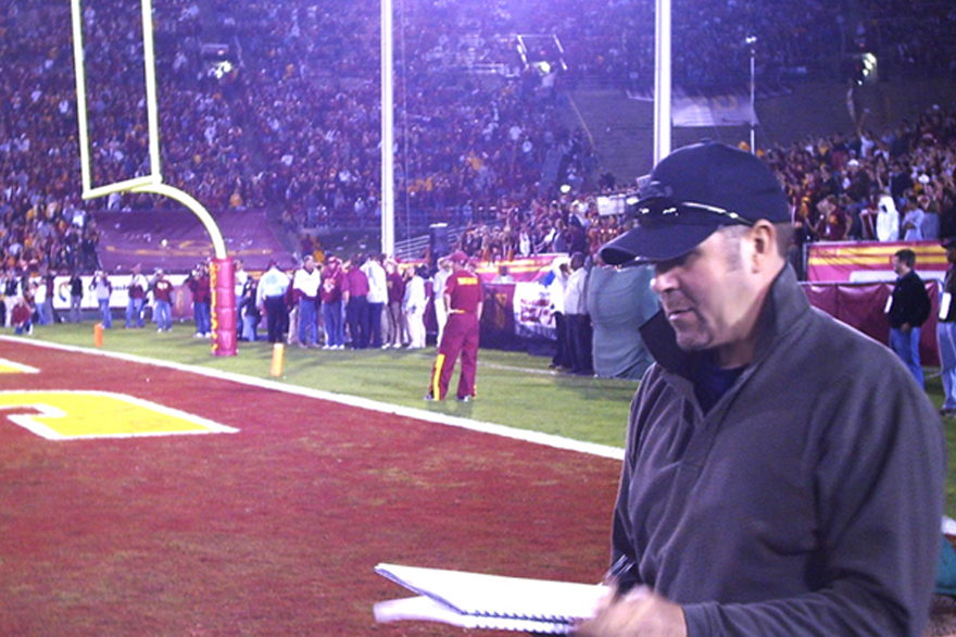Mike S. sketching on the sidelines during a USC game at the LA Memorial Coliseum