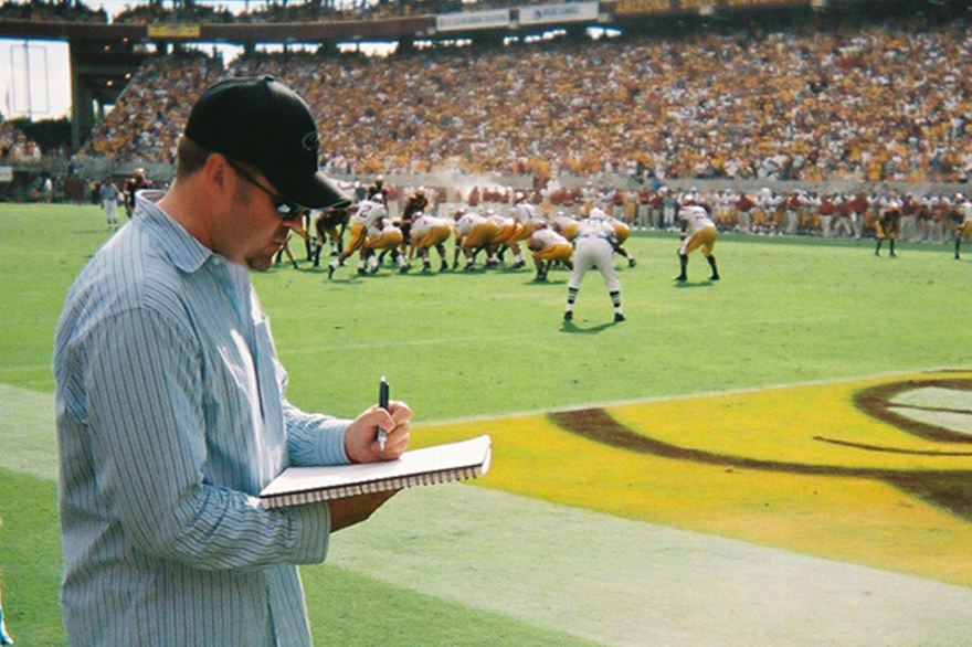 Mike S. sketching on the sidelines at Sun Devil Stadium game in Tempe, Arizona